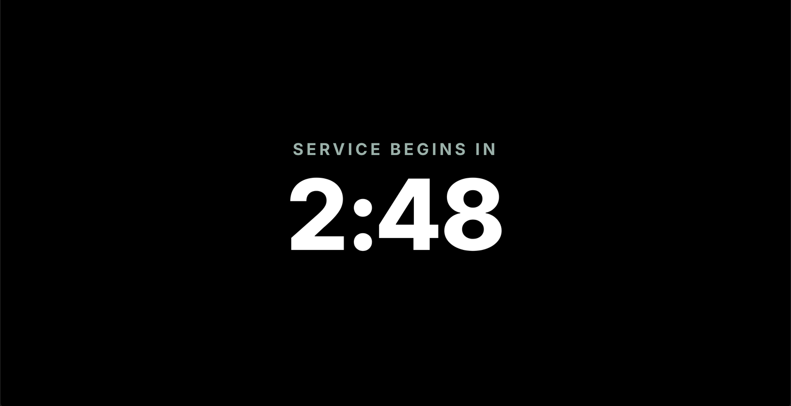 The congregation screen showing SERVICE BEGINS IN with a large countdown.